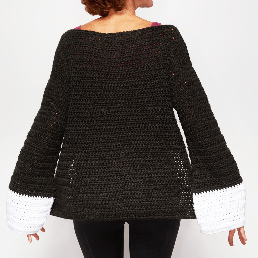 If you’re feeling daring and want to try something new, consider the Wide Sleeve Sweater. #crochetpattern #crochettop #crochetsweater #crochetlove #crochetaddict