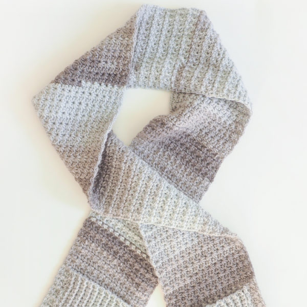 What makes the Cozy Pocket Scarf different from any other scarf are the little pockets on each end which is perfect for warming your hands. #crochetscarf #crochetpattern #crochetlove #crochetaddict