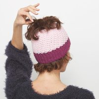 This crochet messy bun hat is sweet and simple, and fun to work on. This is a great crochet pattern to make for yourself or a woman you know. #CrochetMessyBunHat #CrochetHatPattern #CrochetPattern