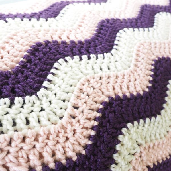 The little ripple crochet baby blanket is sweet and simple. This crochet pattern will stand the test of time and can truly be a special keepsake. #CrochetBabyBlanket #BabyBlankets #BlanketCrochetPattern