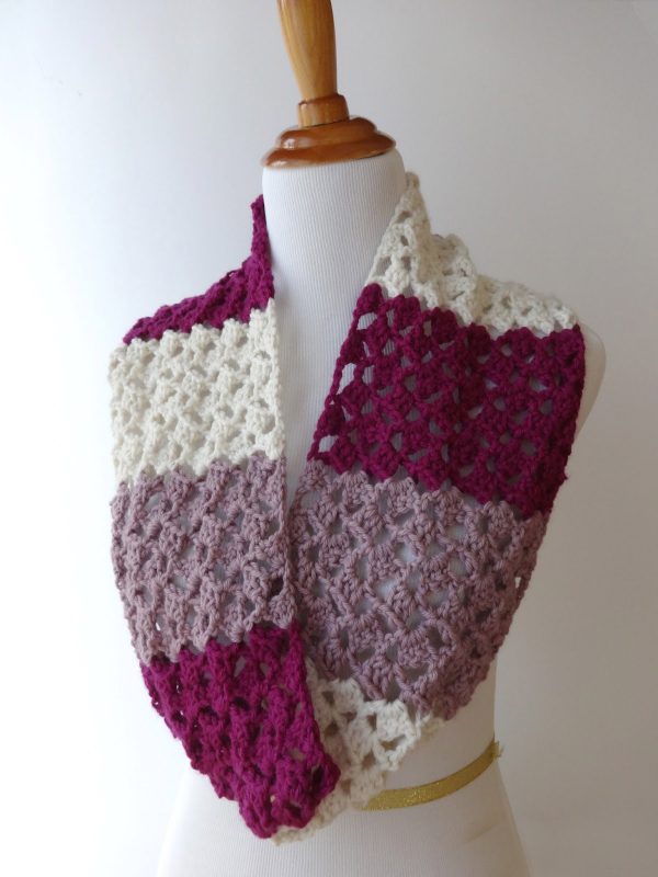 Raspberry Buttercream Infinity Scarf - If you’re thinking of an easy project to do this fall, look no further than these crochet infinity scarf patterns. #crochetscarf #crochetinfinityscarfpatterns #crochetpatterns