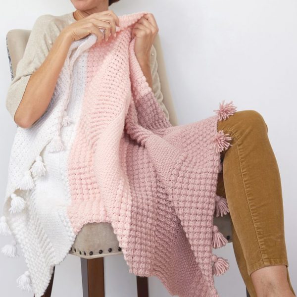Ombre Textured Blanket - This list of 17 easy crochet afghan patterns has a good variety of styles and stitches that will allow you to flex your crochet muscle. #easycrochetafghanpatterns #crochetafghanpatterns #crochetpatterns