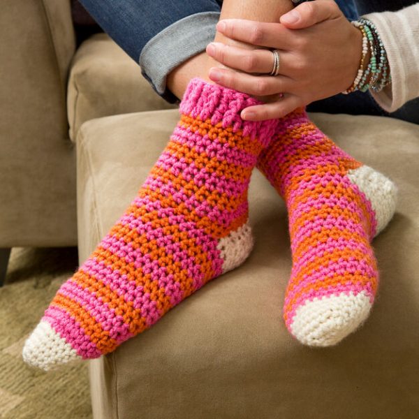 Red Heart Cozy At Home Crochet Socks - These free crochet sock patterns are the perfect gift to those who always seem to lose a pair or who prefer to keep their toes toasty at all times. #freecrochetsockpatterns #crochetsockpatterns #crochetpatterns