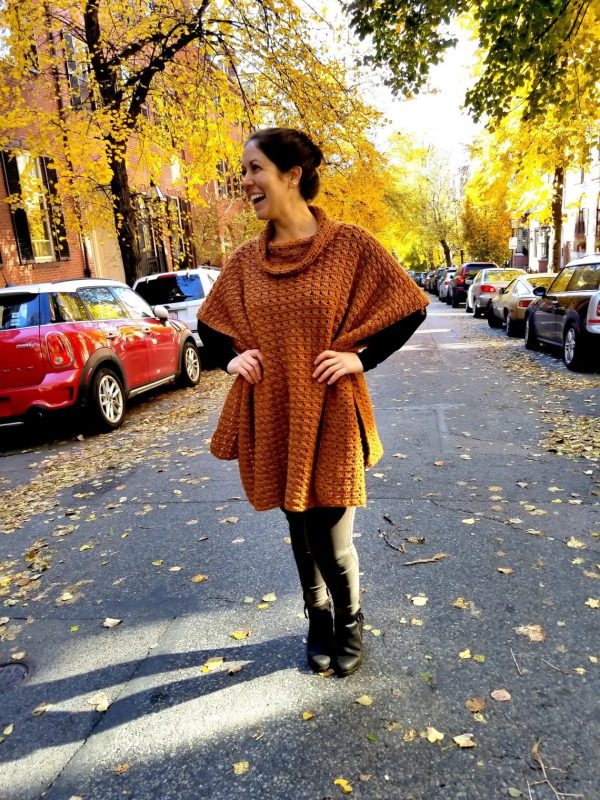 A woman wearing the Beacon Street Crochet Poncho