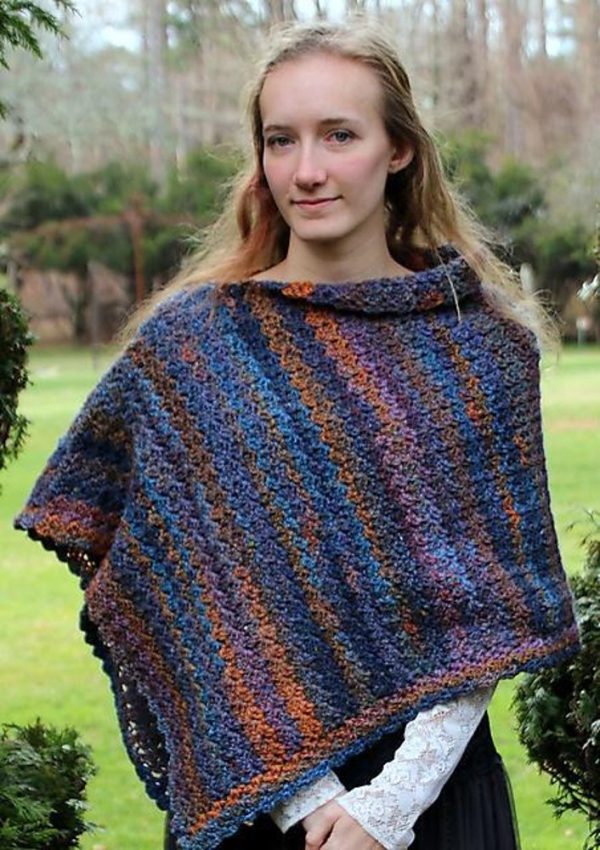 A woman wearing the Chelsea Crochet Wrap