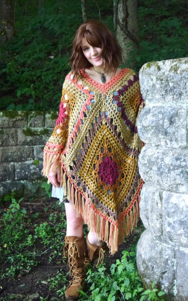 A woman wearing the Kismet Crochet Poncho