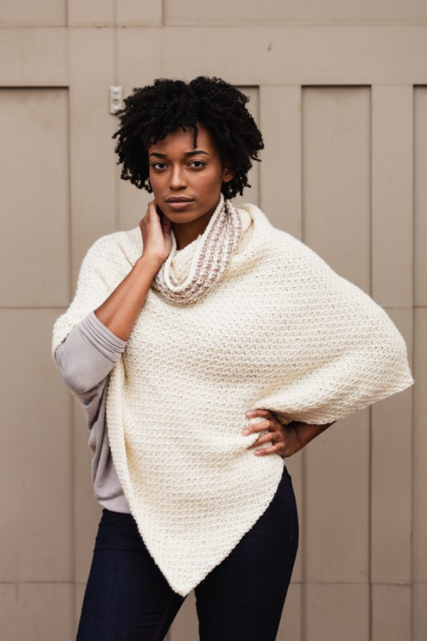 A woman wearing the Hot Cocoa Crochet Poncho