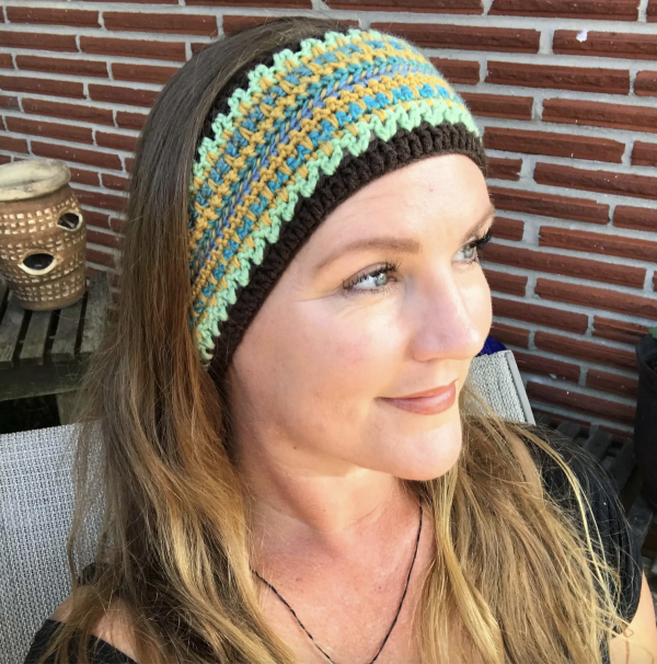 A woman wearing a Boho Crochet Headband
