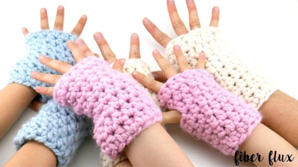 children wearing chunky mittens crochet by fiber flux