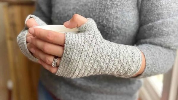 a woman wearing mystical mittens fingerless gloves