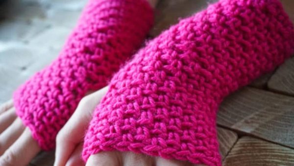 a person wearing texting crochet gloves